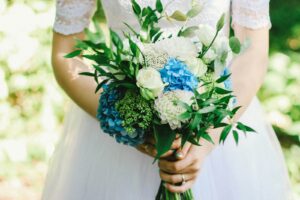 woman holding bouquet of flowers